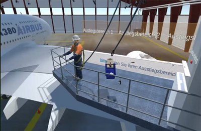 Airbus-Projekt Virtual Reality Sicherheitstraining: Szene Arbeiter auf Hebebühne neben Flugzeugflügel.